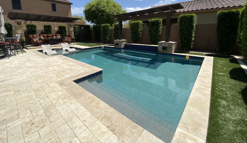 Custom pool and outdoor living space built by Saturn Pool Company in Arizona
